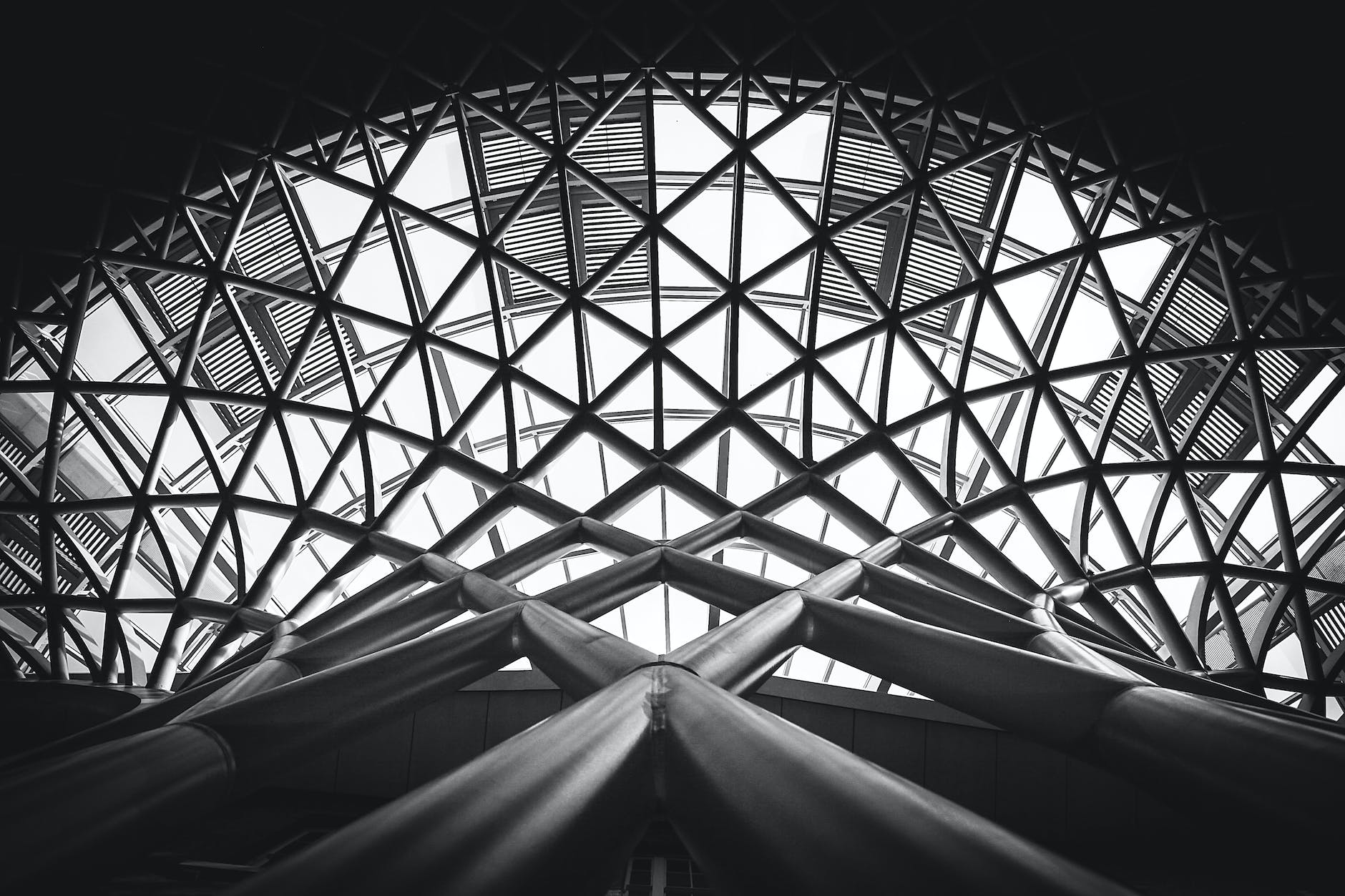 low angle photography of metal building on grayscale
