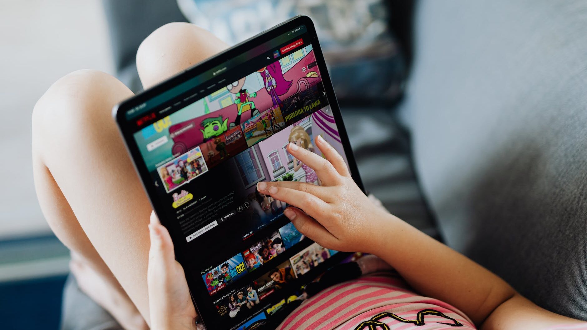 little girl holding a tablet