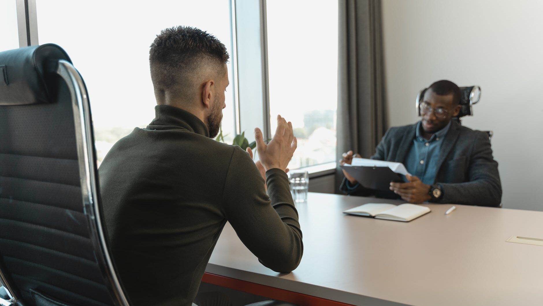 businessman looking at employee