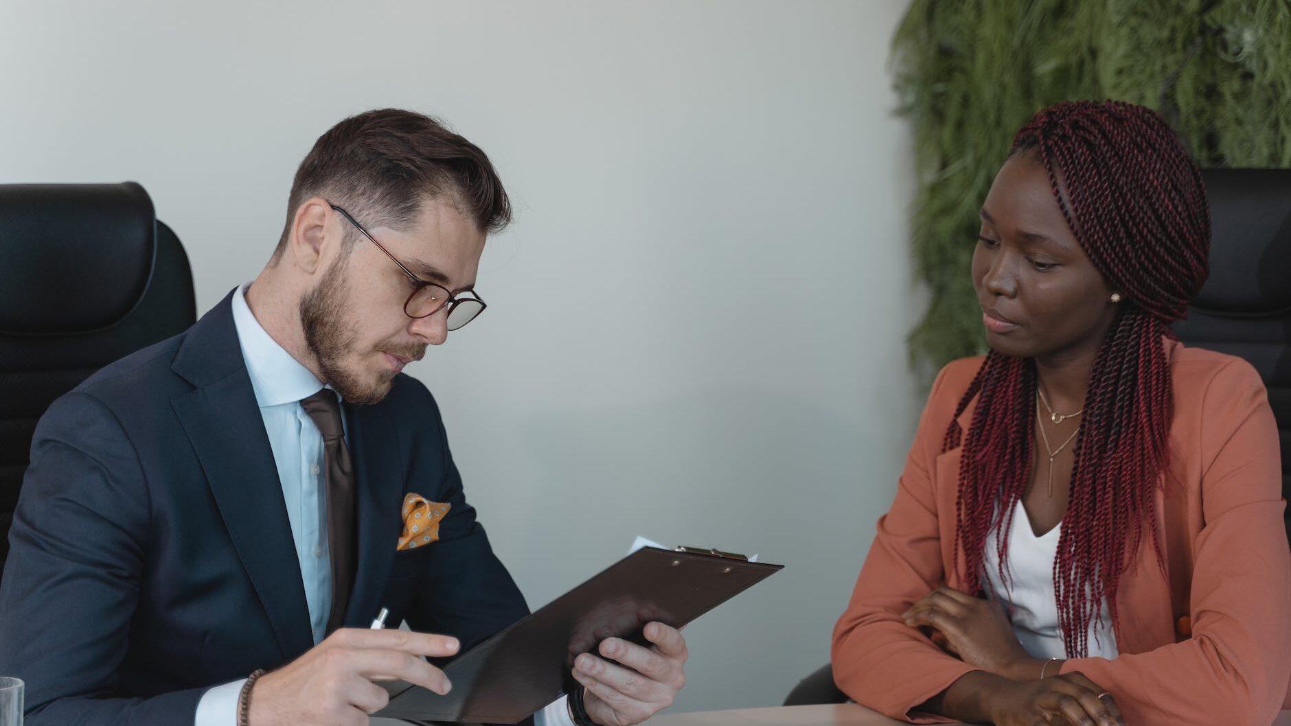 man reviewing woman s resume