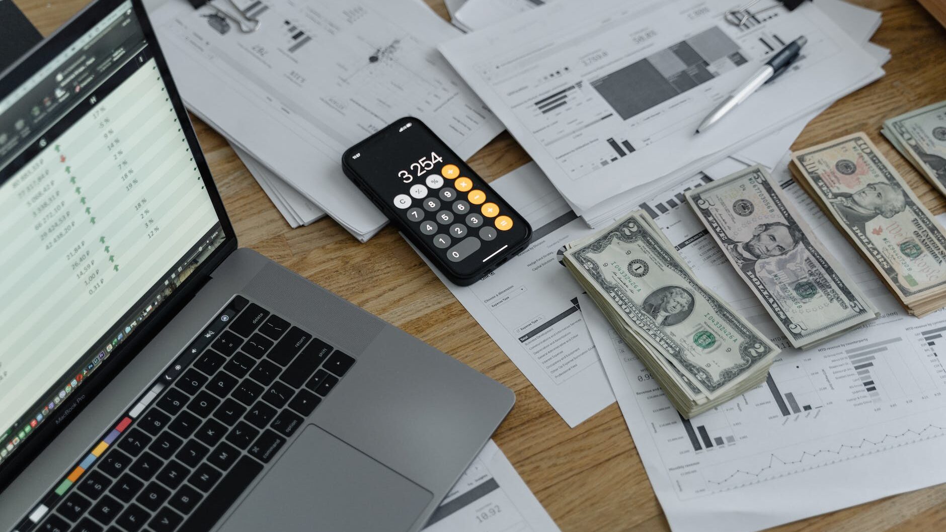 banknotes and calculator on table