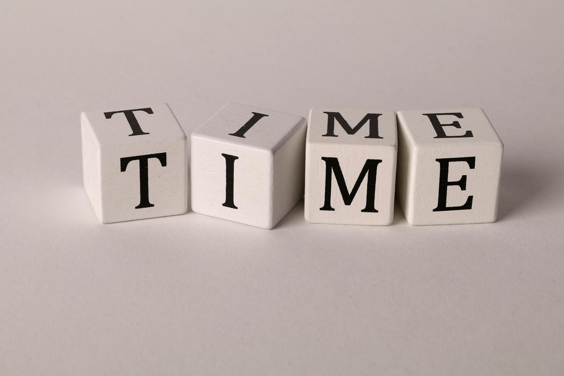 time on dices on white background